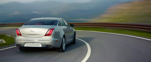 XJ Premium Luxury LWB Rear angle view